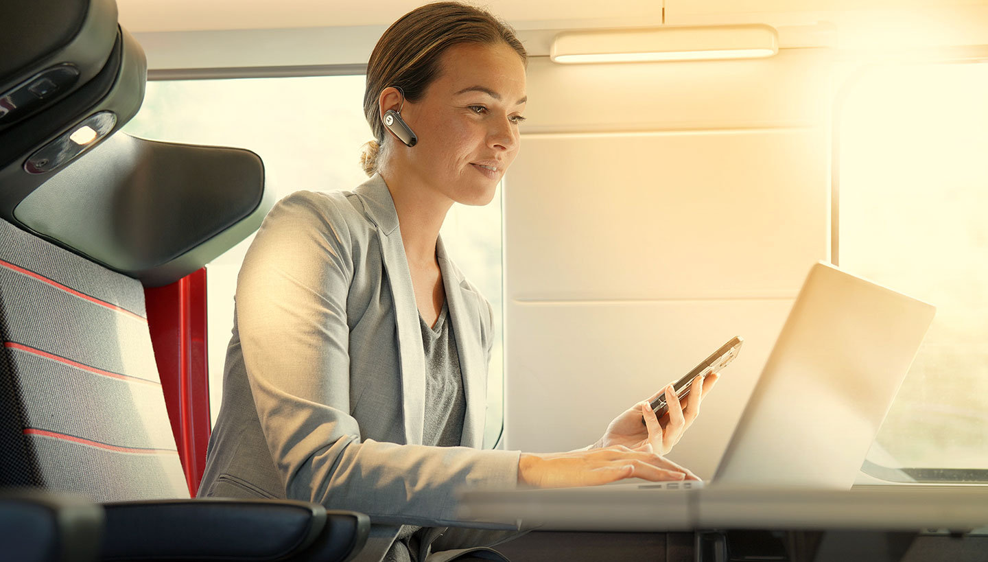 Subject enjoying HK125 wireless mono headset with Multipoint connectivity